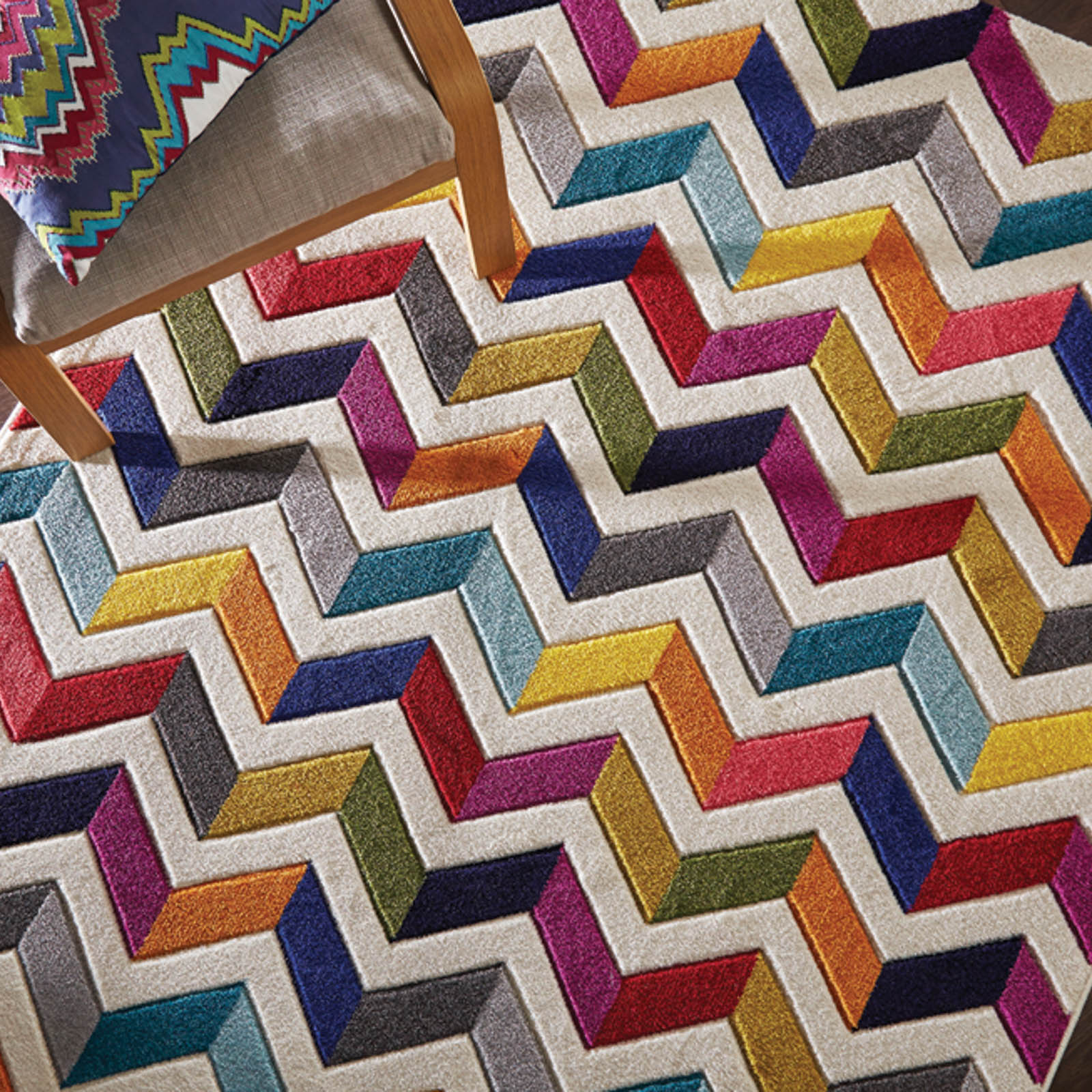 Spectrum zigzag and multicoloured rug part of a joint competition