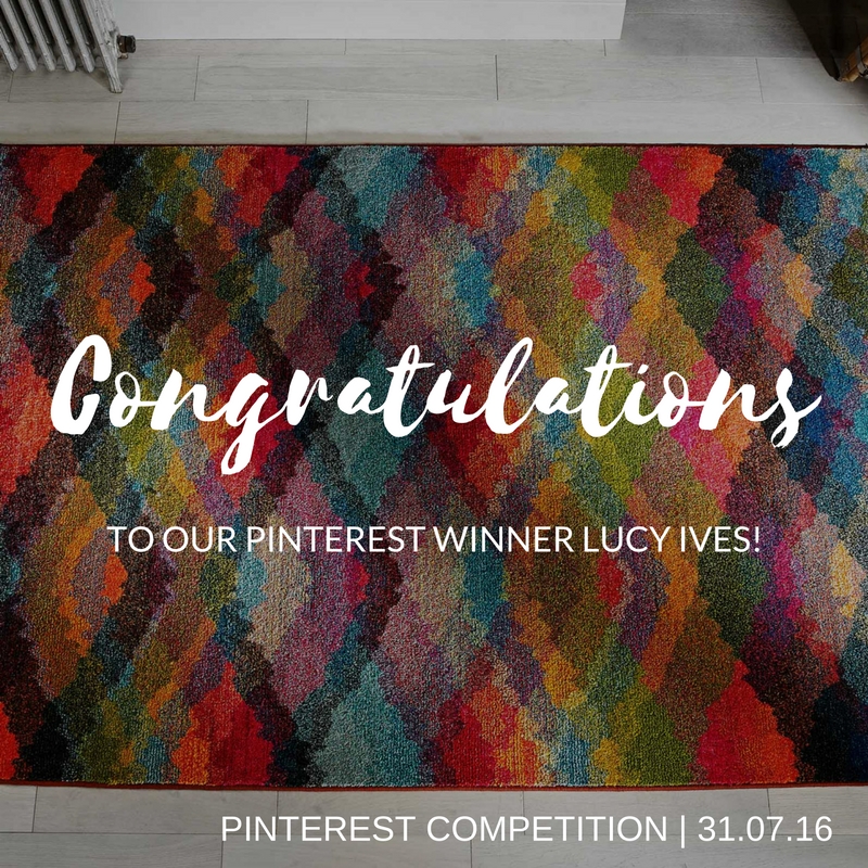 Multicoloured Kaleidoscope rug on a grey wooden floor for Pinterest Competition