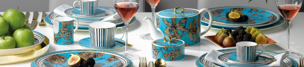wedgwood vibrance tea set on a table with a white tablecloth amongst wine and food