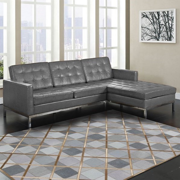 copper interiors cowhide rug with copper strips over denim in a plainly decorated room with a dark grey sofa