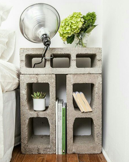 concrete breezeblock bed side table in a white bedroom