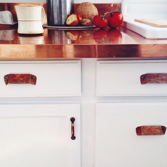 copper worktop and handles with white cupboards for copper interiors