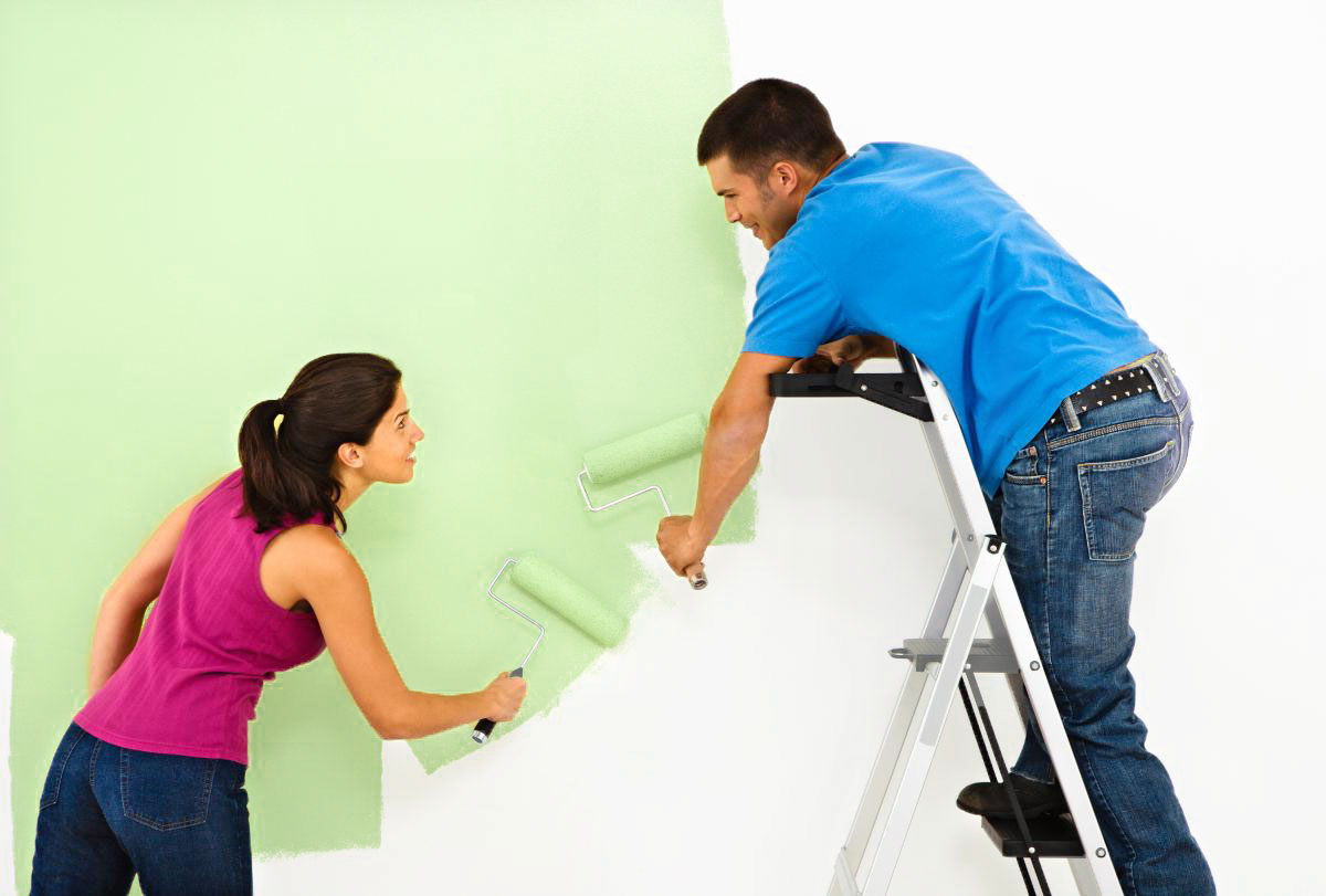 how to paint a room man and woman painting a white room green
