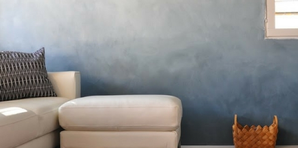 colour trend for 2017 denim blue ombre wall with pale cream sofa in shot