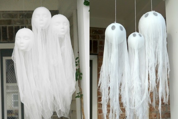 DIY halloween decorations of floating head ghosts hung by the front door