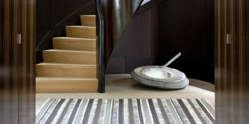 stripes trend shades of grey coloured rug in a large interior