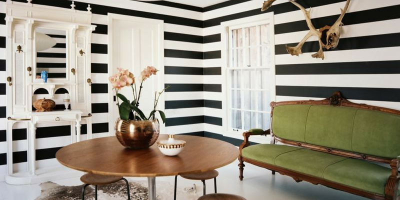 stripes trend black and white monochrome living room with green sofa
