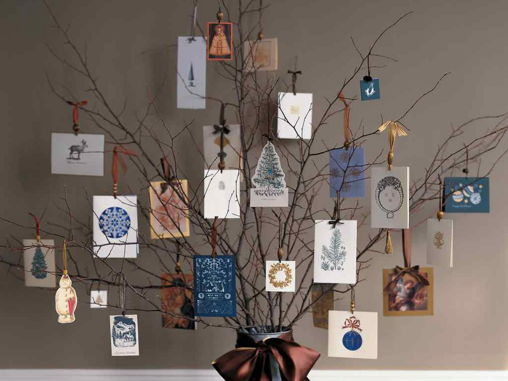 Christmas hanging christmas cards on a tree
