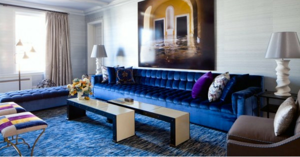 interior design trends, a large living room with jewel tone blue accents