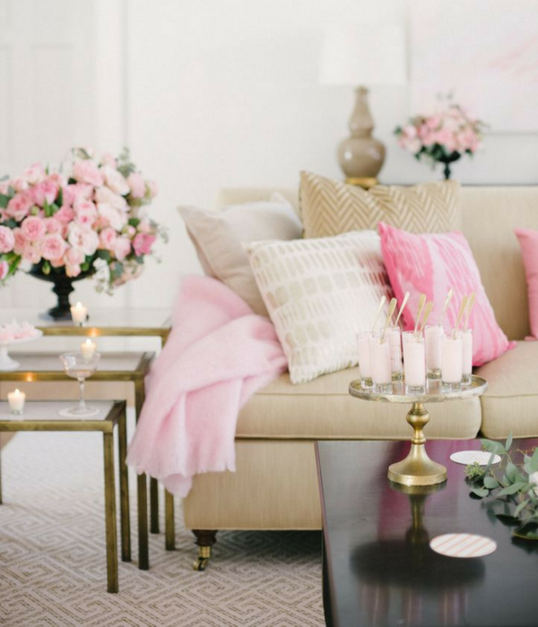 blush pink living room with floral accents placed around the room