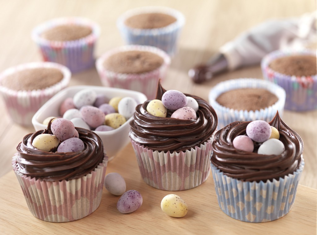 Cupcakes finished with chocolate icing and mini eggs