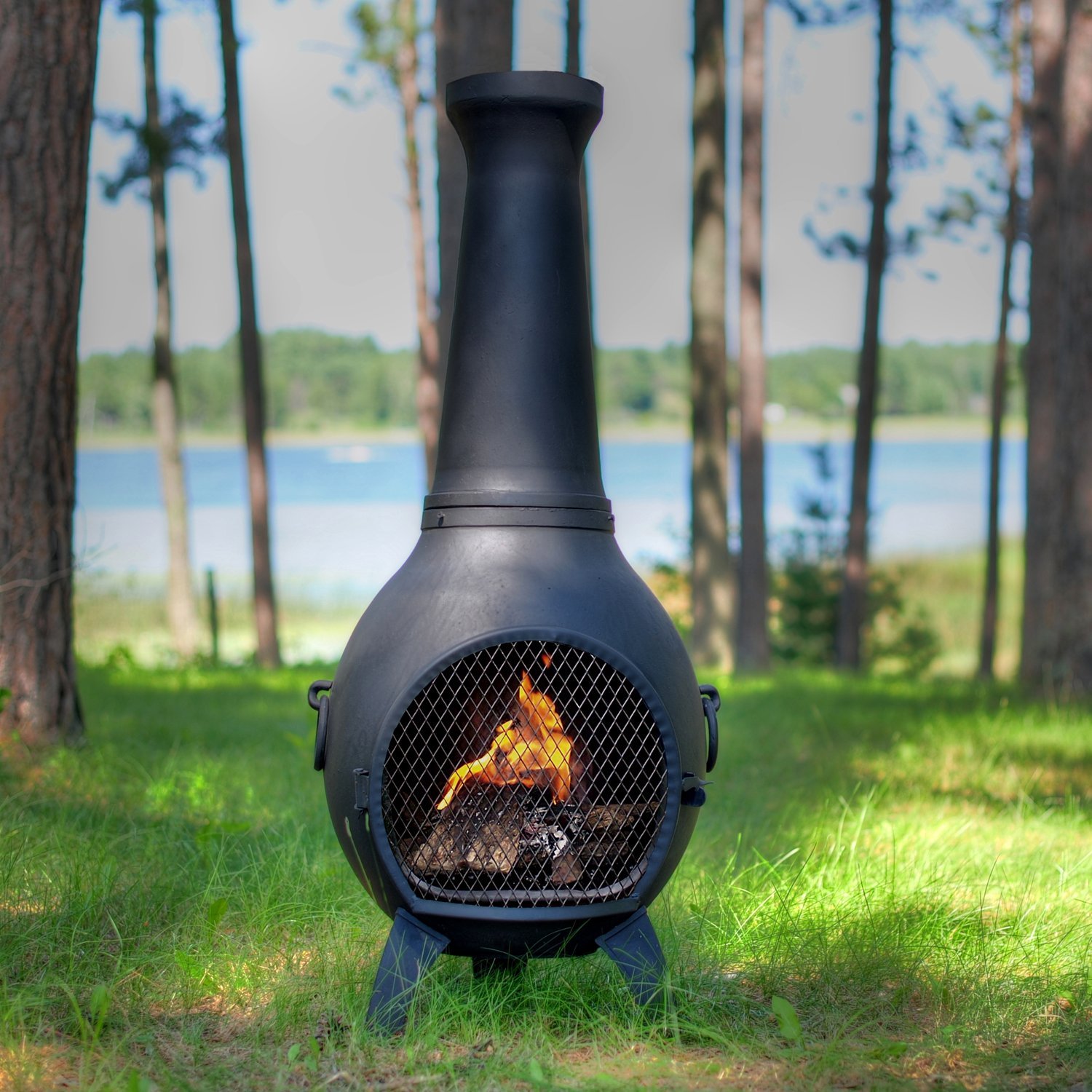 industrial style chiminea in a green garden on grass