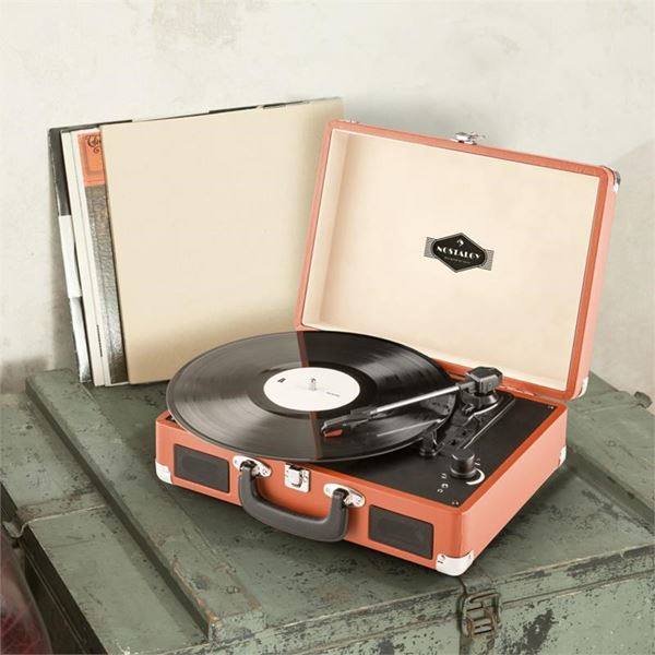 Vinyl record player on top of green military storage box