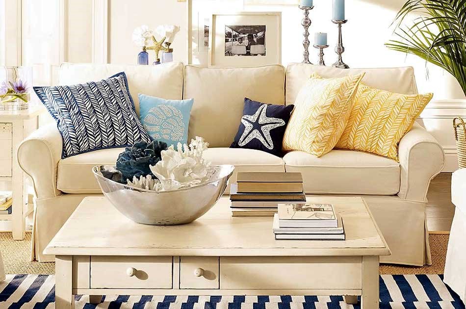 a beach or nautical inspired summer living room with patterned cushions
