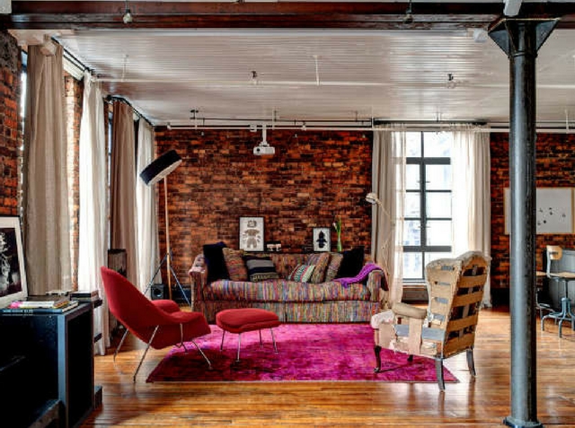 loft like living room with mismatched furniture