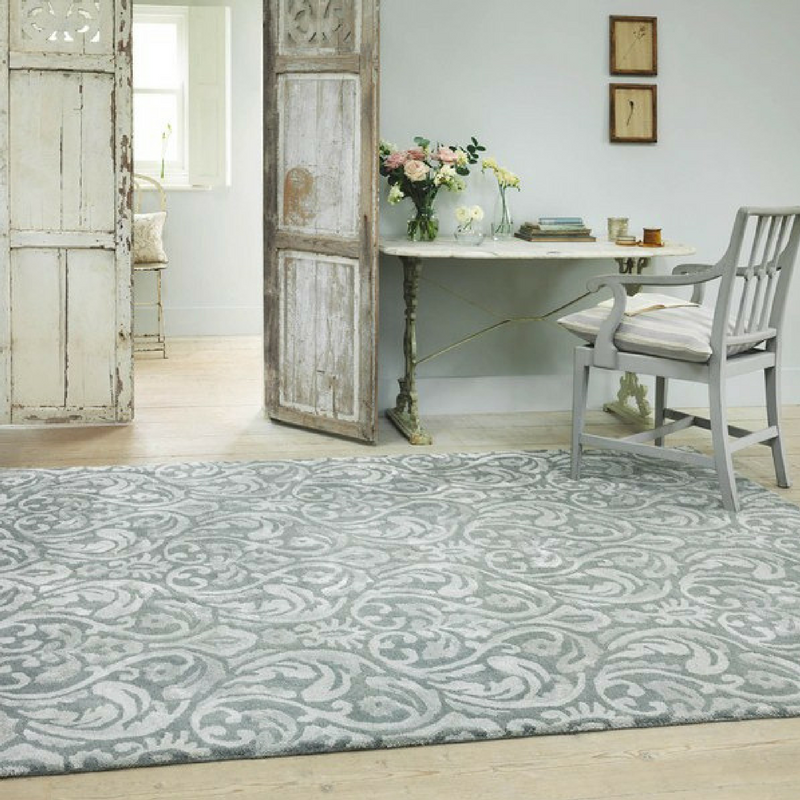 grey and white rug from the rug seller in a vintage looking game of thrones room
