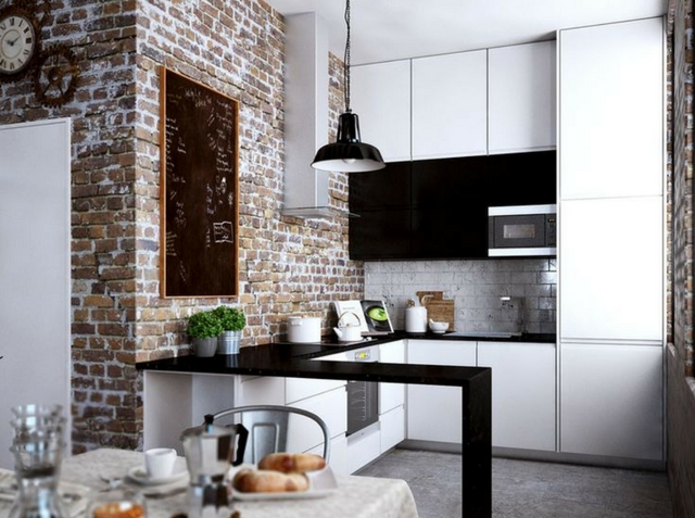 a loft interior with an exposed brick kitchen and dining room