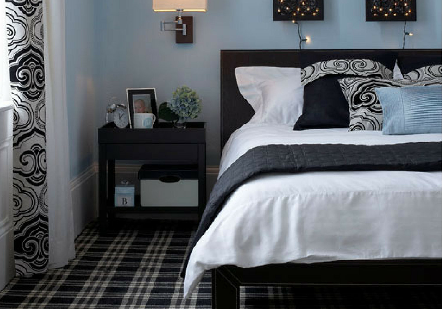monochrome bedroom with tartan plaid flooring