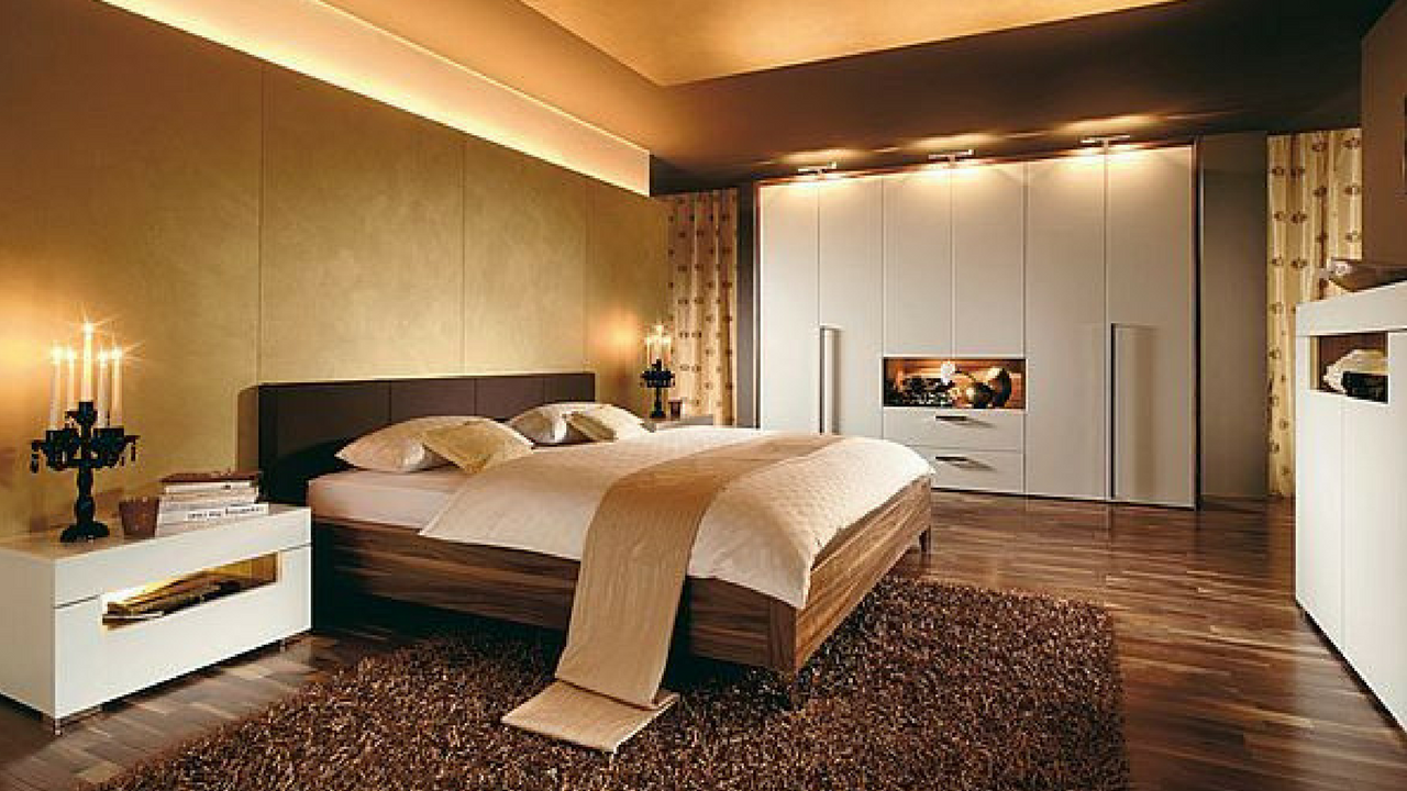dark colours a stylish brown coloured bedroom with ceiling lighting