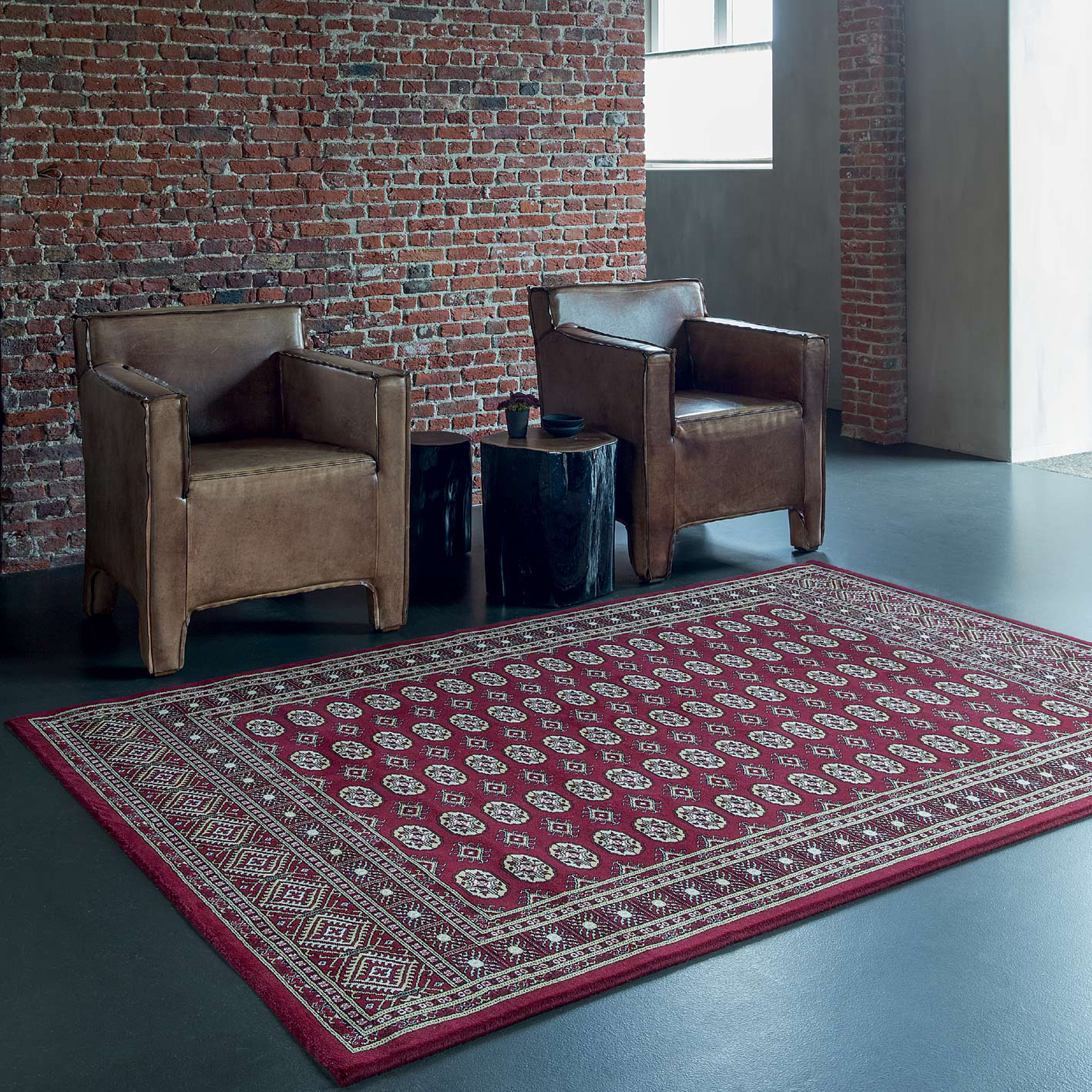 red noble art traditional rug in industrial styled interior with 2 chairs and a table