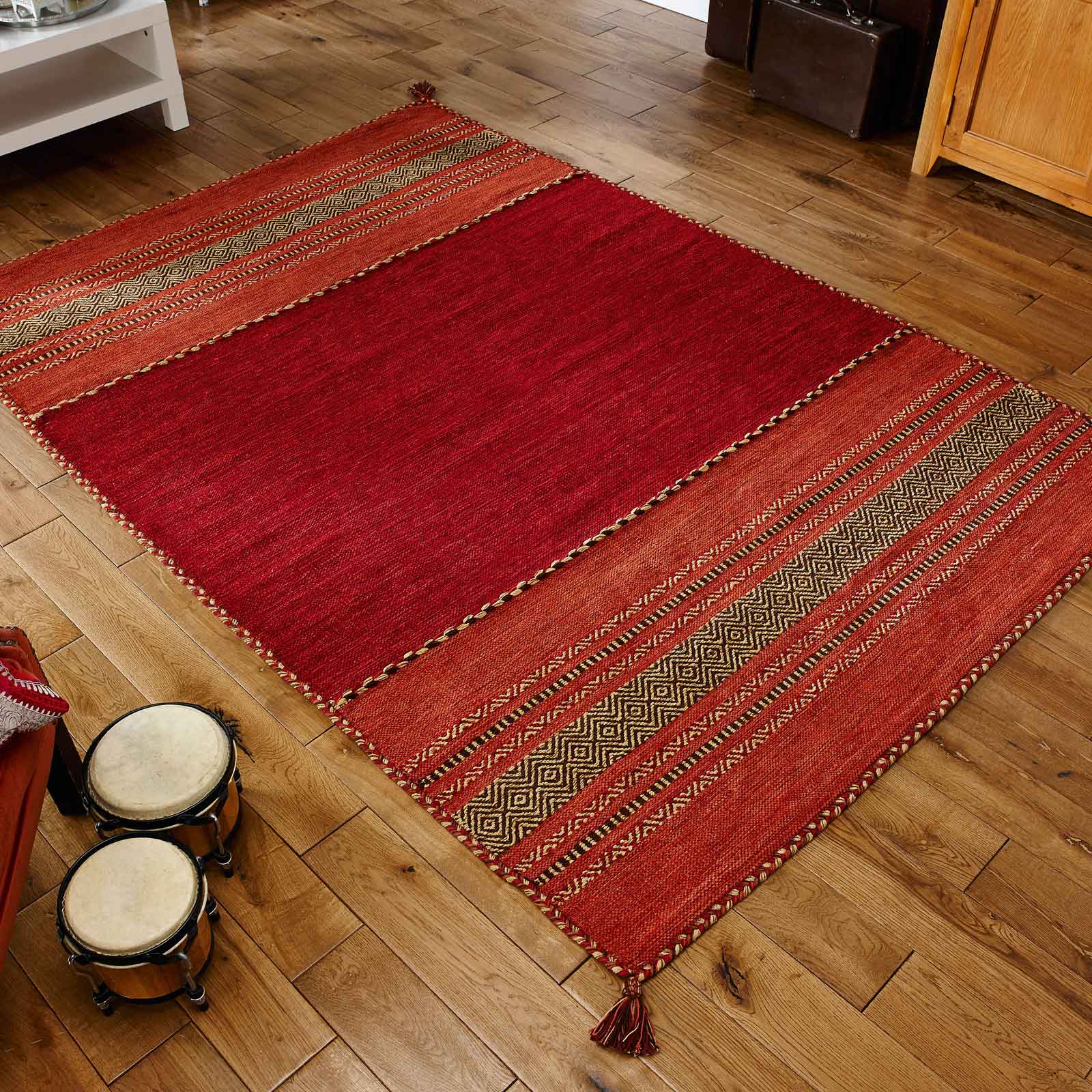 red kilim rug on wooden floor