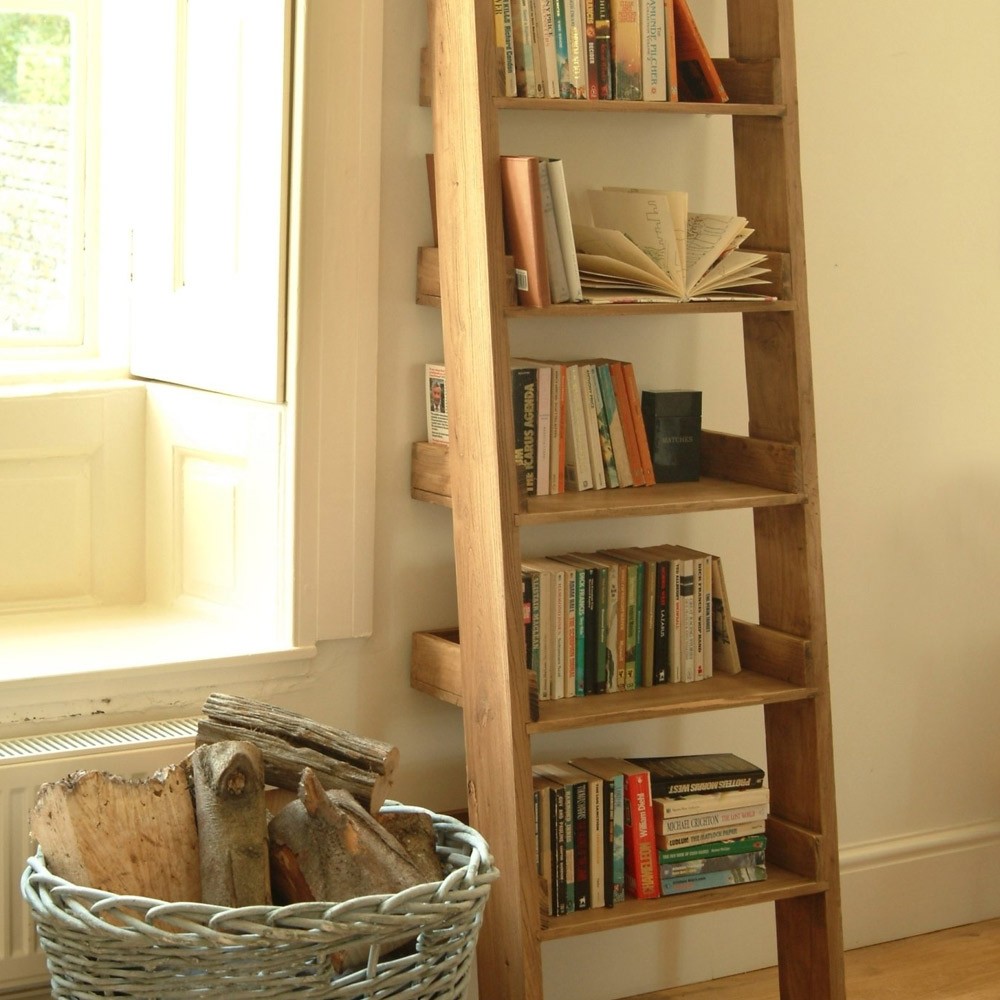 wooden ladders converted into new shelves with books on