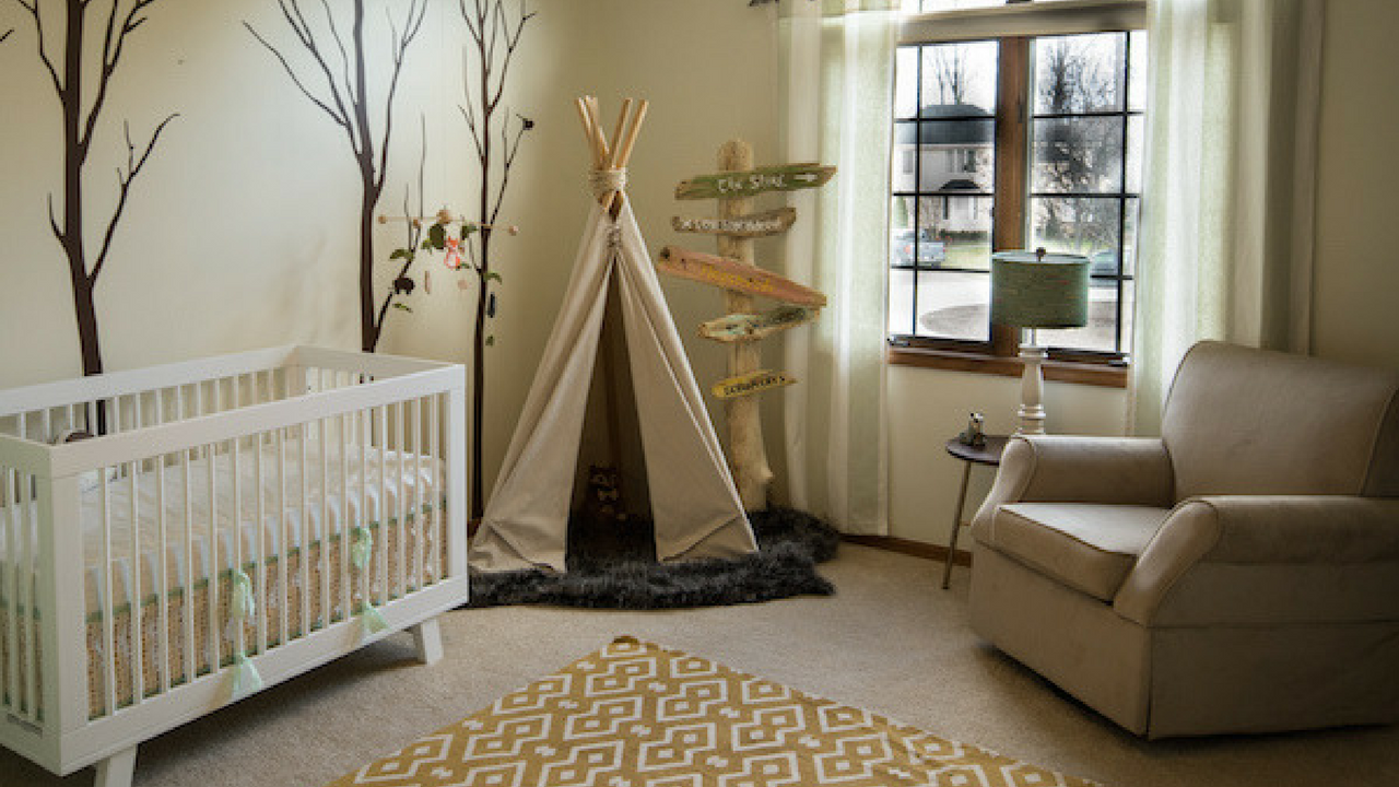 woodland theme decor in a large beige nursery