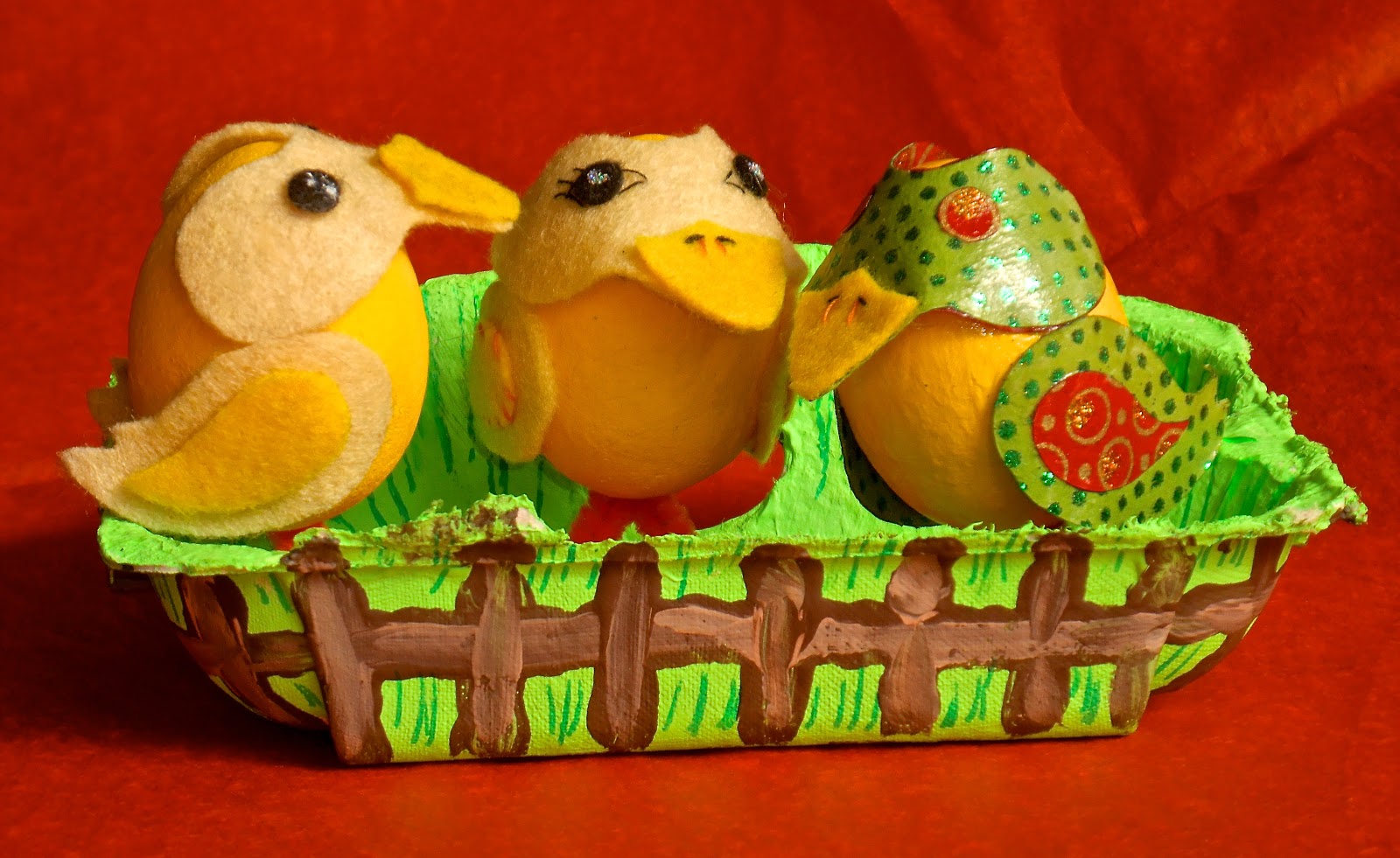 hand decorated eggbox with decorated eggs inside