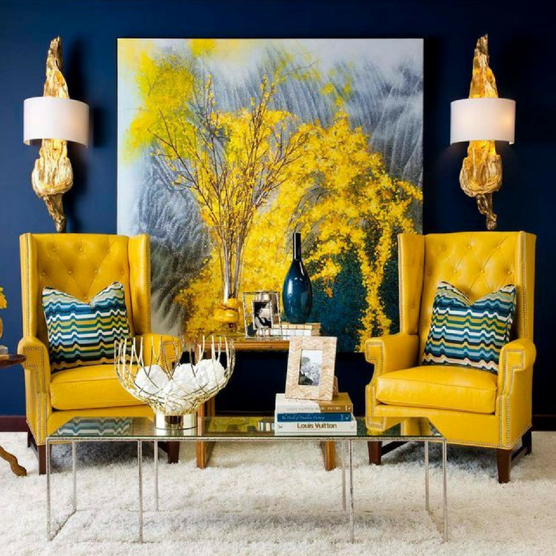 Sophisticated style in a large living room with yellow sofa chairs