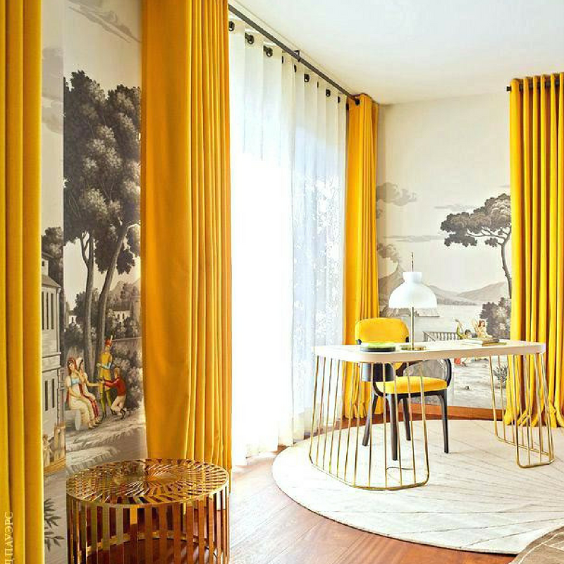 Mustard yellow long curtains in a large dining room