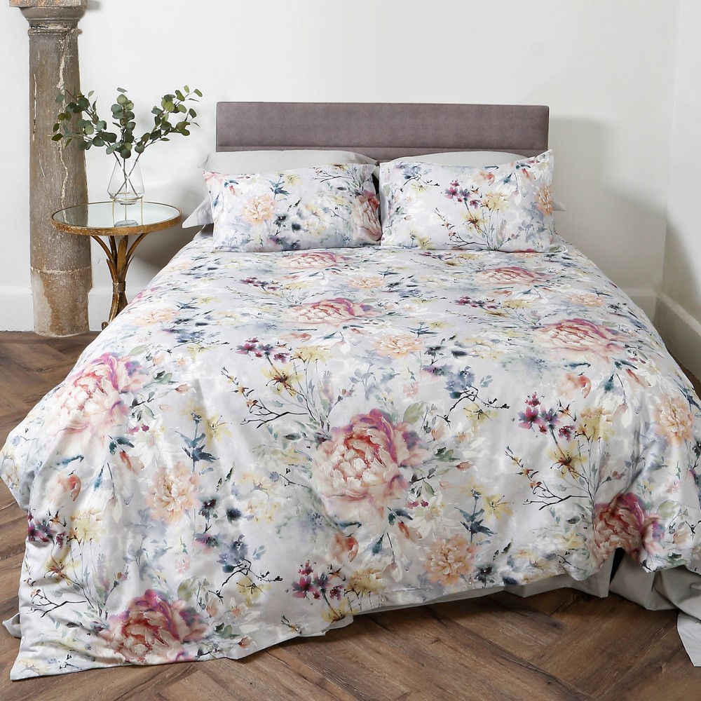 eden bedding in grey with pink floral pattern on a bed in a modern styled bedroom