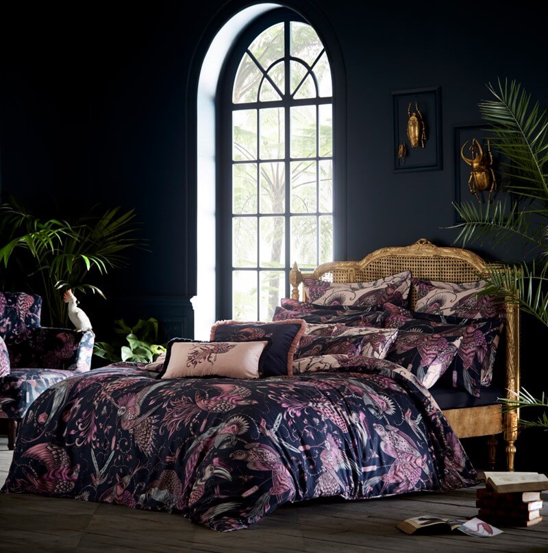 autumnal bedding in dark purple and navy room with bird print bedding