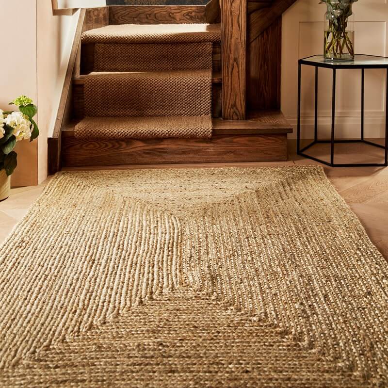 jute rug in a warm, neutral room for autumn interior trends