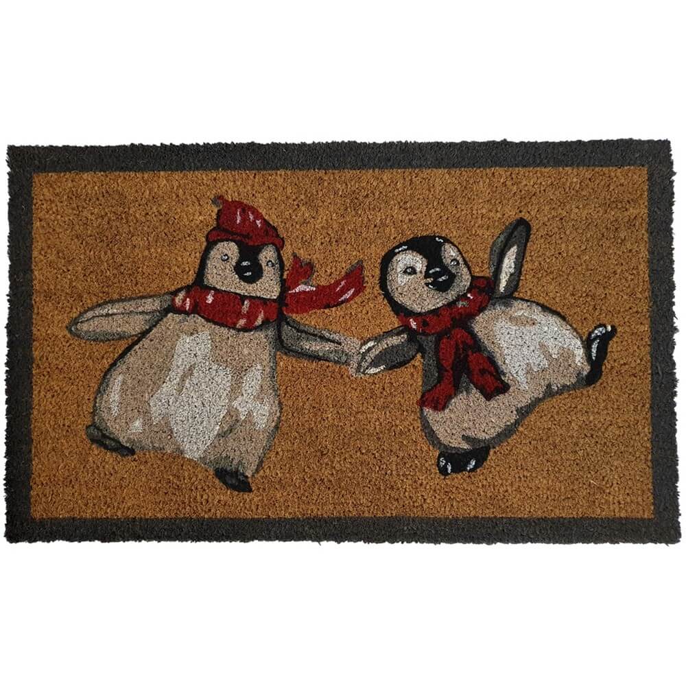 a natural doormat with a motif of two baby penguins in a cartoon style wearing knitted hats and scarves