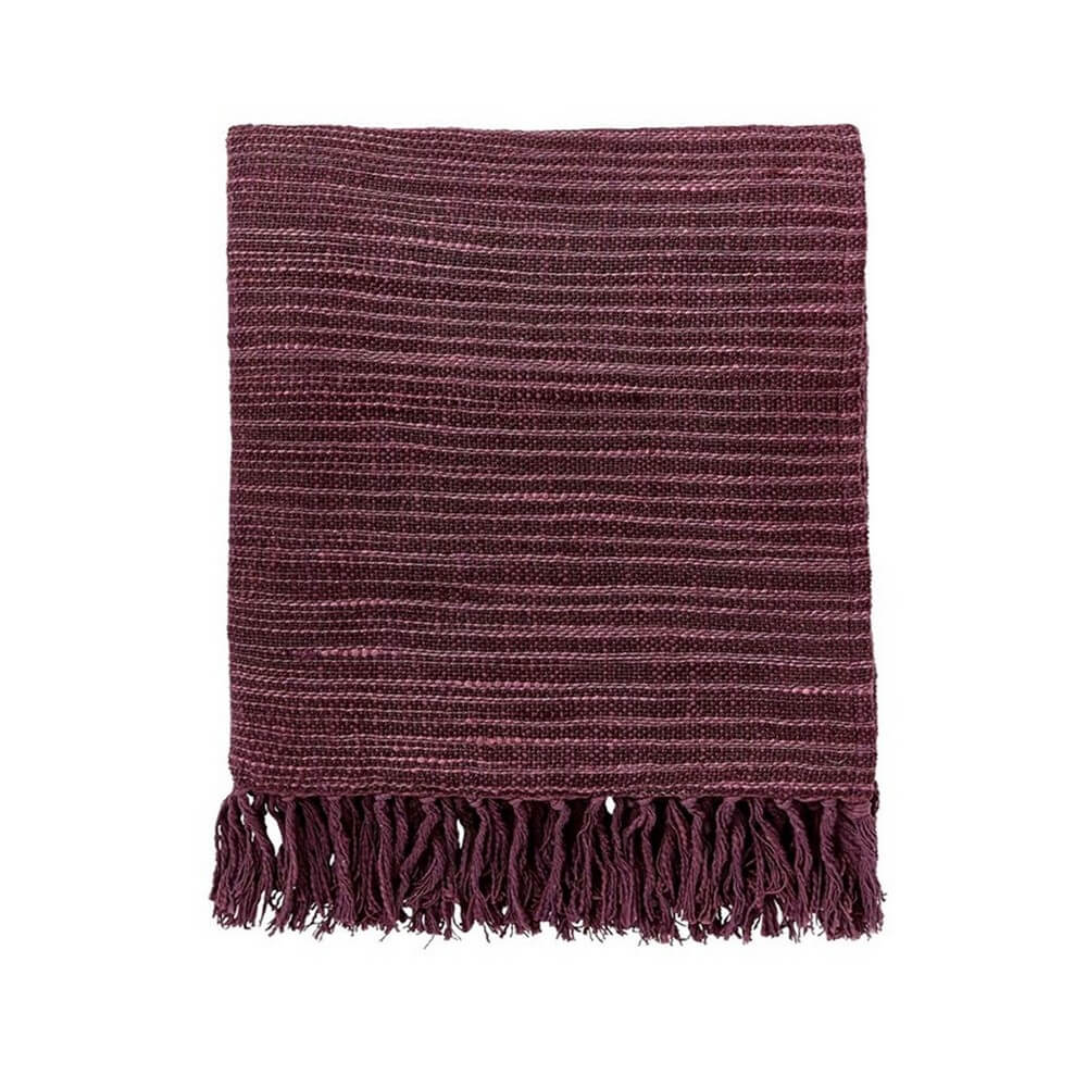 image of an aubergine throw with texture and tassels on a cut out white background
