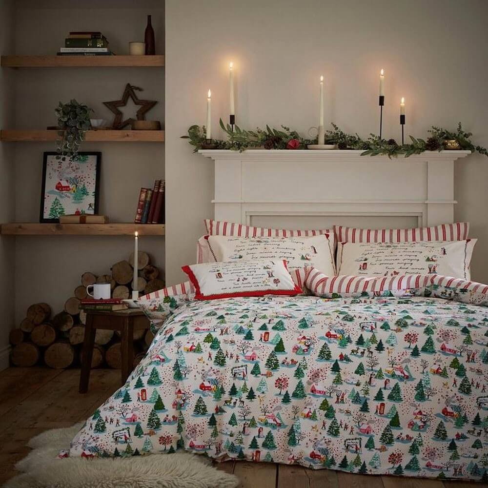 Cath Kidston festive home accessory bedding with a festive snowscape on a bed in a festive bedroom