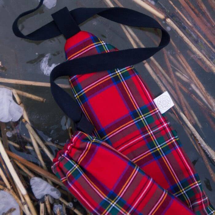 a black friday gift close up image of the yuyu hot water bottle with a tartan red cover