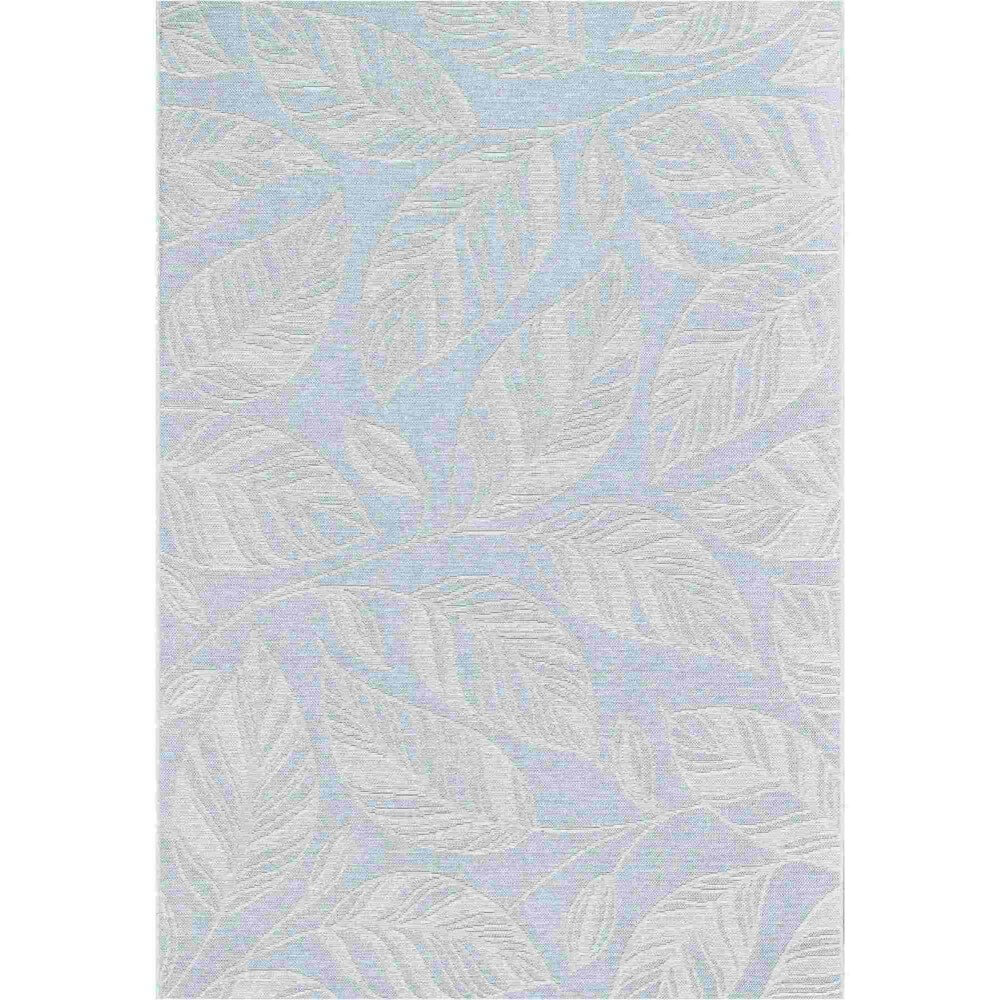 a blue flatweave rug with leaf patterns on it against a white cut out background