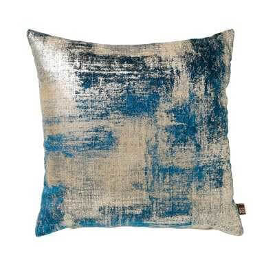 a velvet cushion in a cut out background i=with a blue abstract brushed design