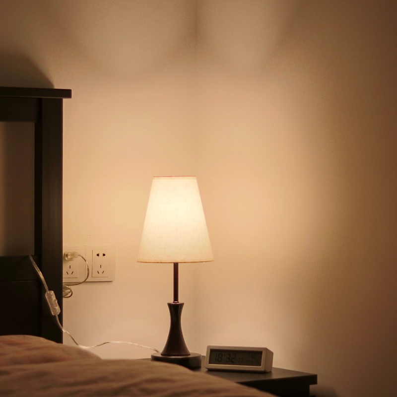 low lit lamp in a cosy bedroom setting