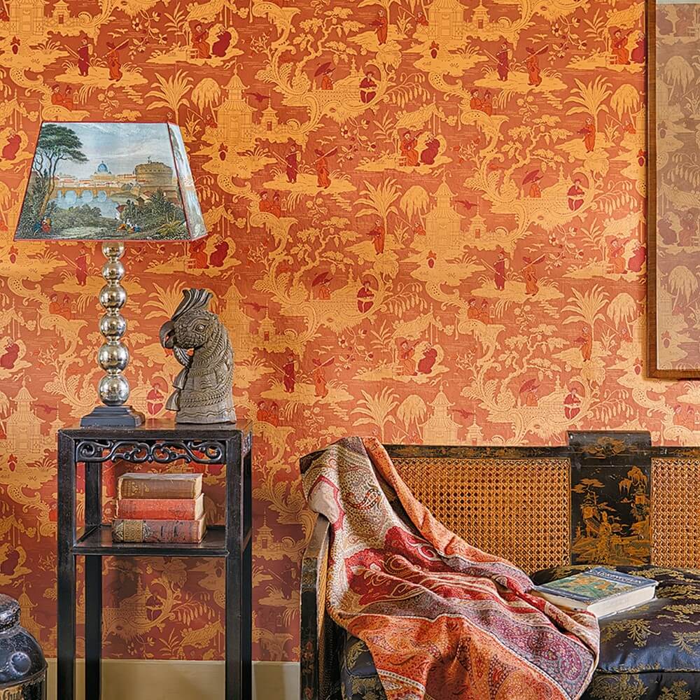 bold orange orientalist style wallpaper in a living room