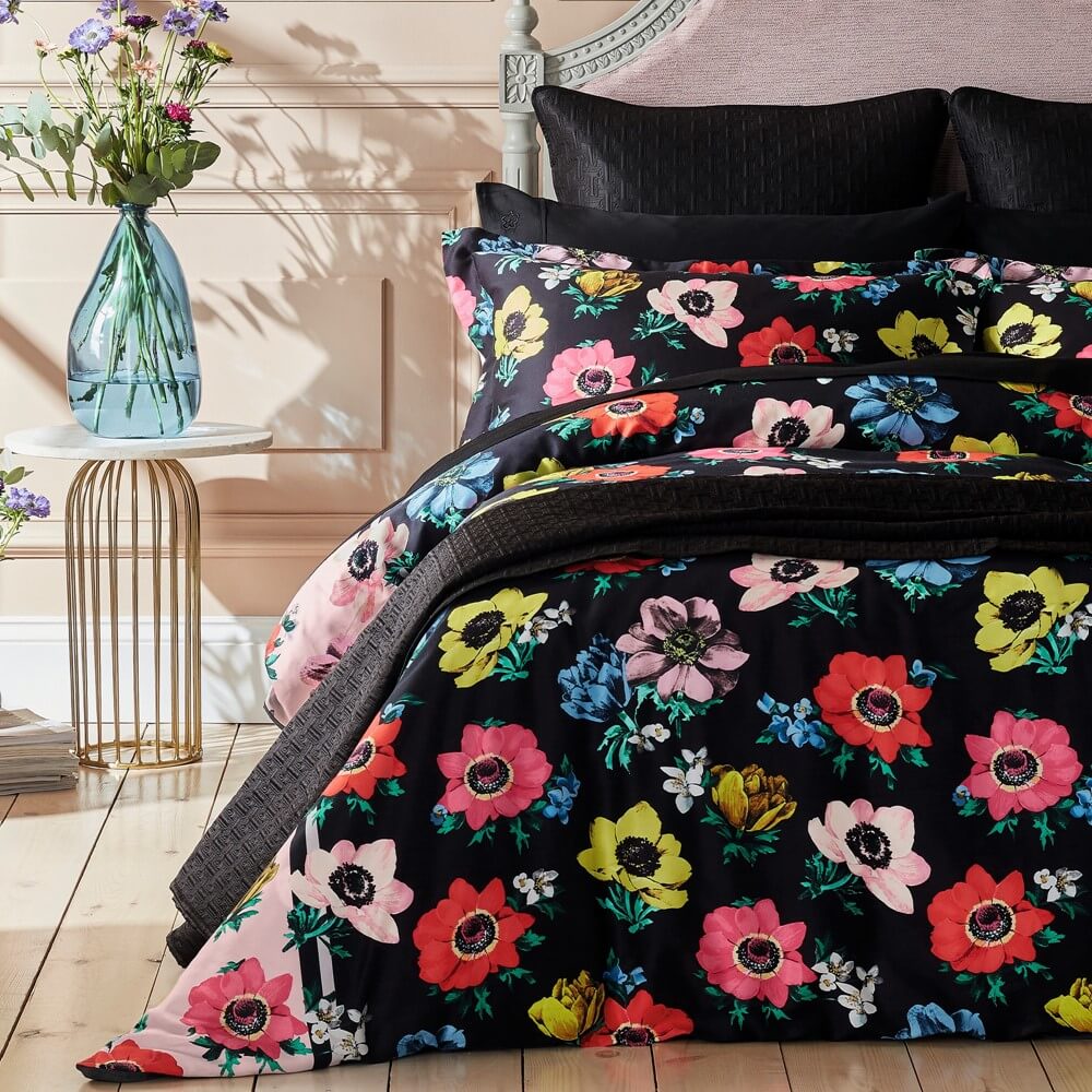 bright floral ted baker bedding with black base colour in a bright bedroom