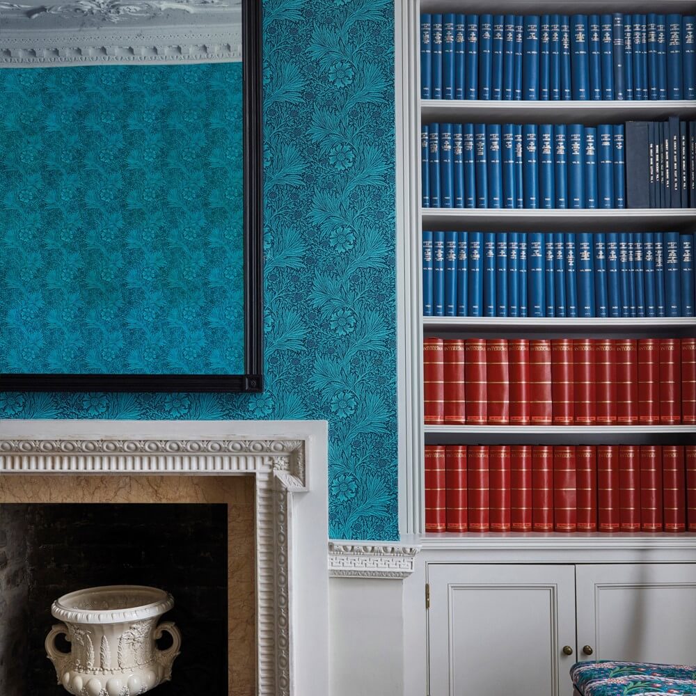 Wallpaper trends with the blue marigold wallpaper in a living room