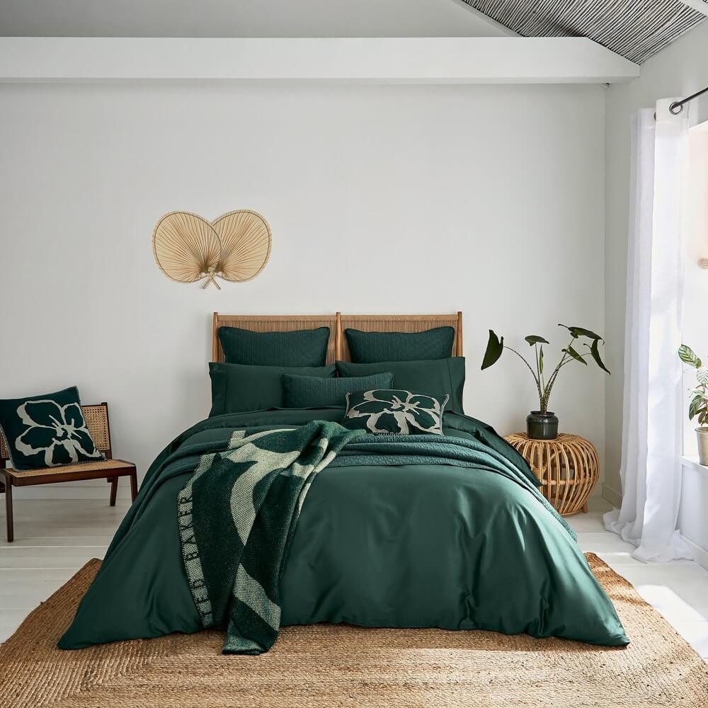 green interiors bedding in a bright bedroom