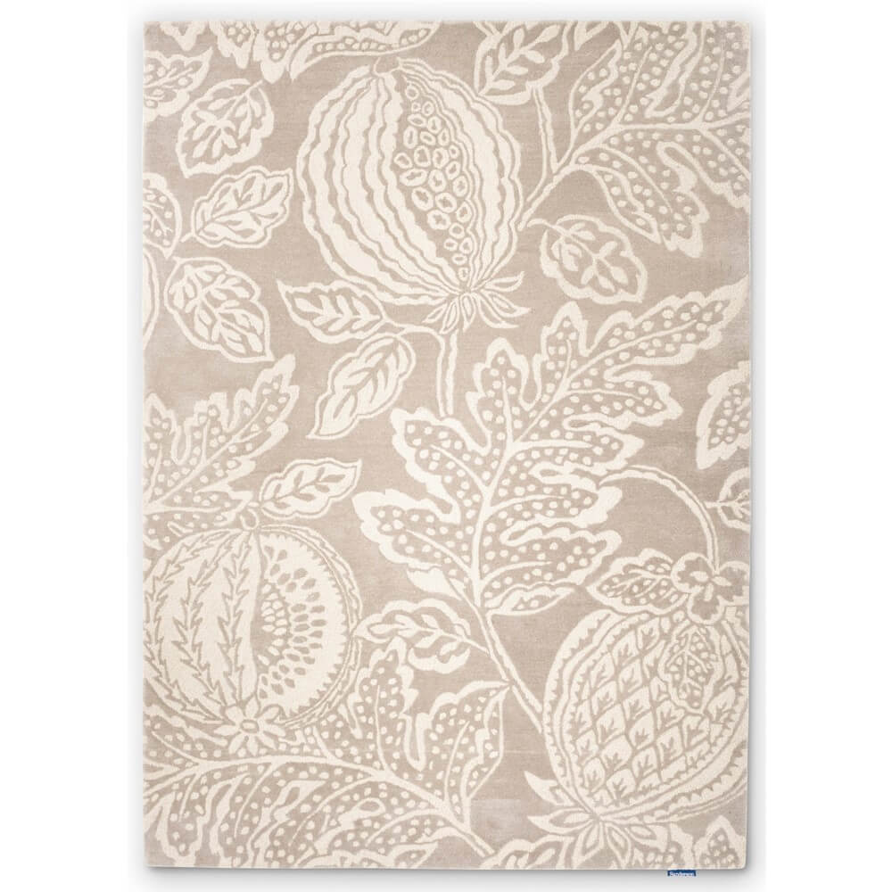 A cut out image of a beige floral tapestry wool rug