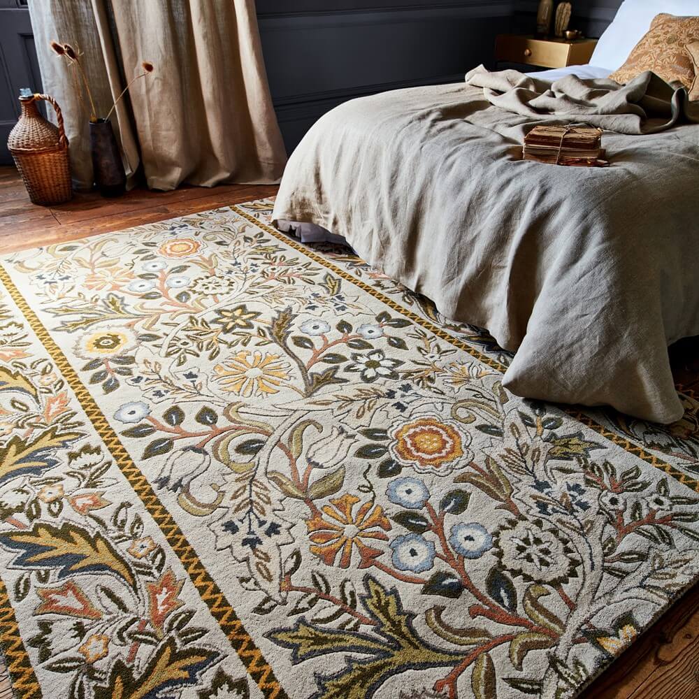 William Morris rug on floor of a bedroom in florals as a winter rugs to help you save on energy bills